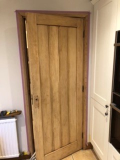 Wooden kitchen door painted in Helo Aqua 20